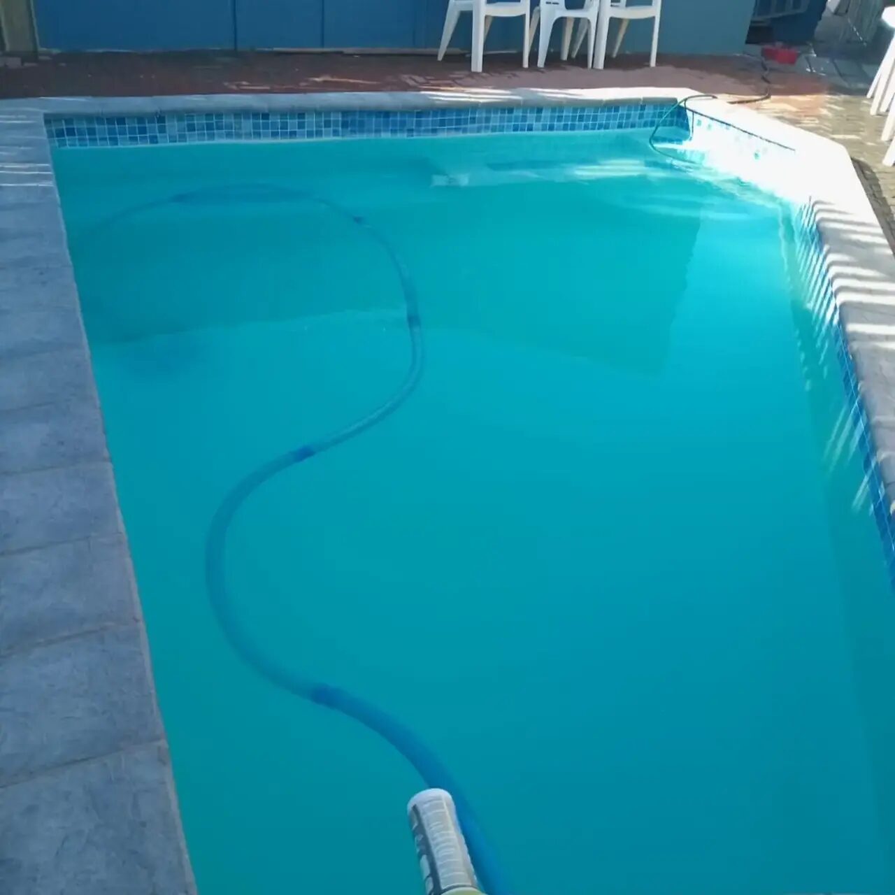 Vacuuming a tiled pool